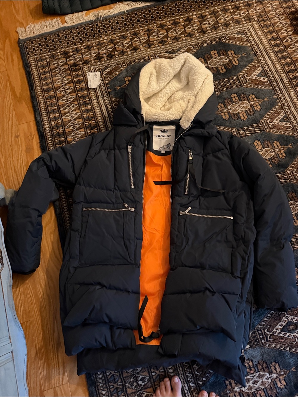 Orolay Men’s Black Puffer Jacket with Sherpa Hood and Orange Lining